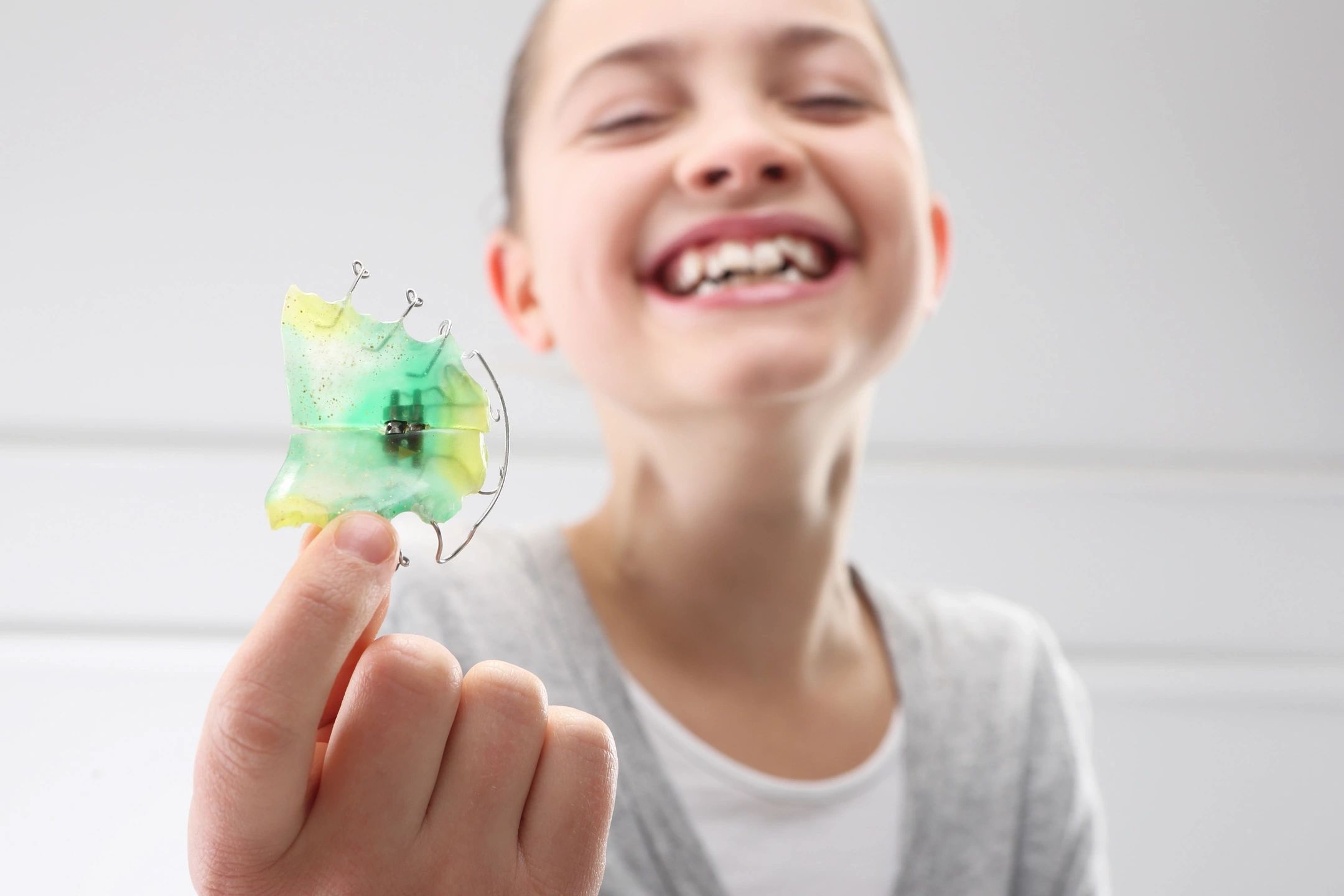 When should my child be seen by an orthodontist?