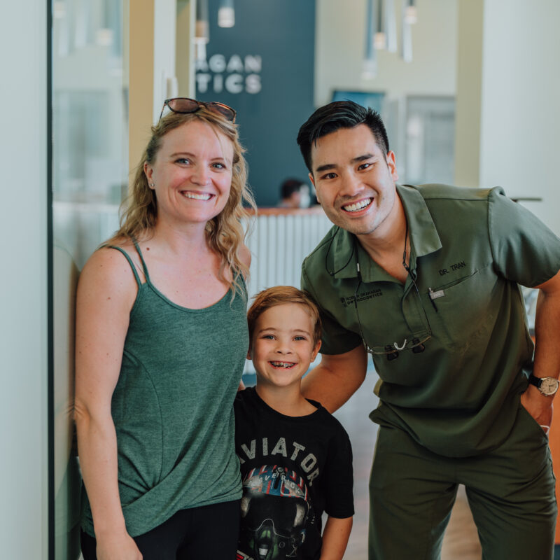 orthodontist with young patient in braces